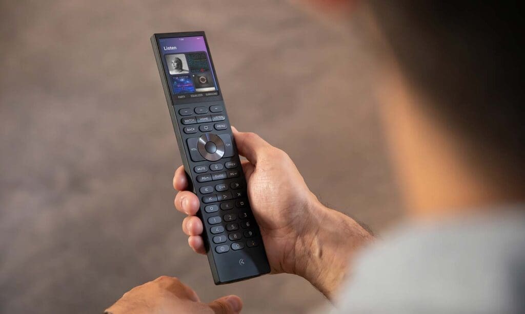 Person holding a control4 remote
